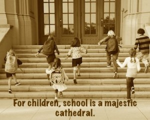 Children running up school steps